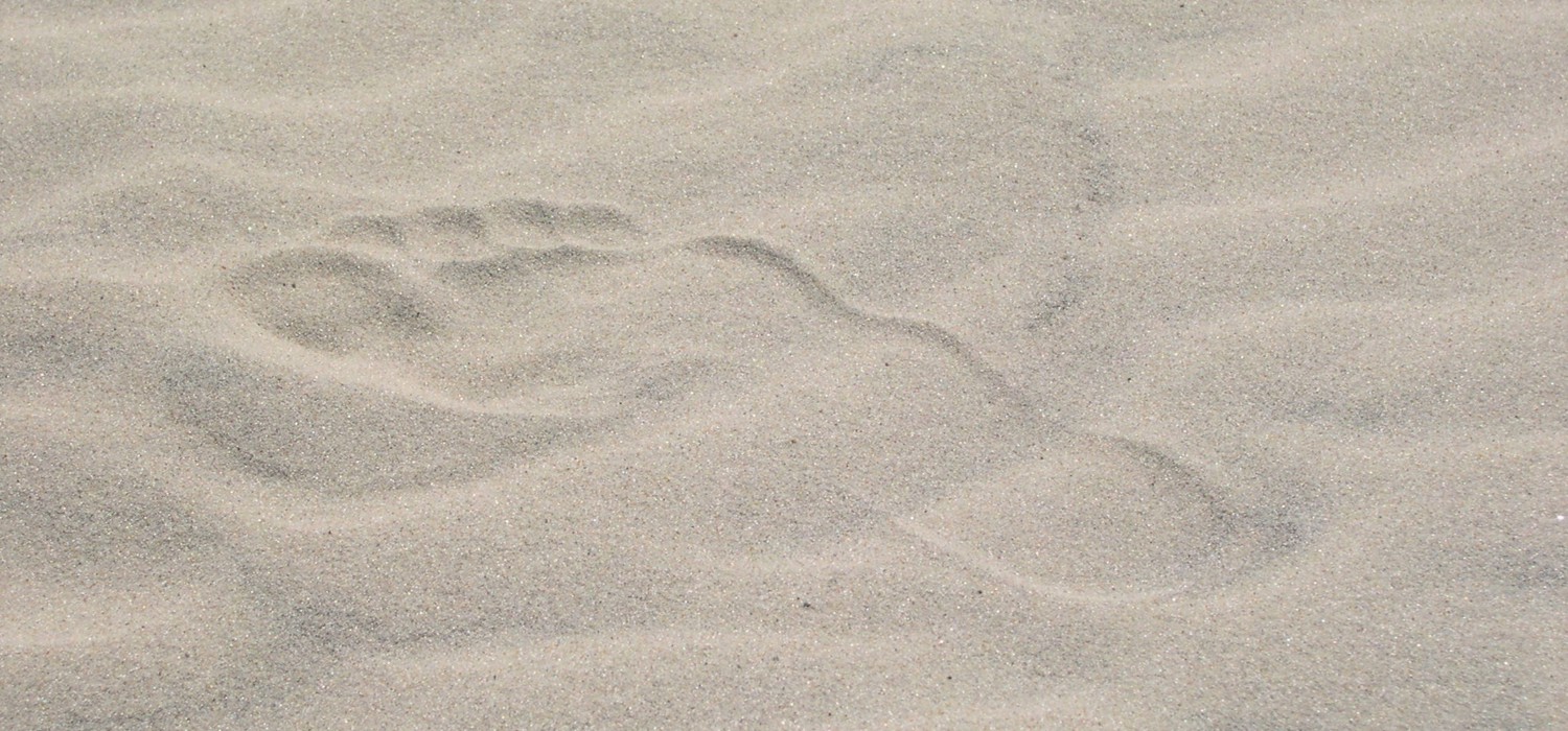 Fotavtrykk i sand